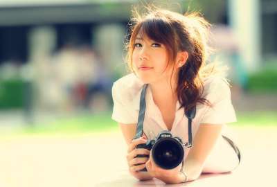 Asian Girl With A Camera
