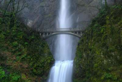 Bridge by a Waterfall