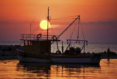 Full Sunset Over Boat