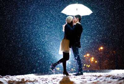 Girl and Boy Kissing in Snow