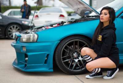 Girl Next to Blue Modified Car