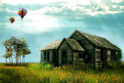 Hot Air Balloons Over an Old House