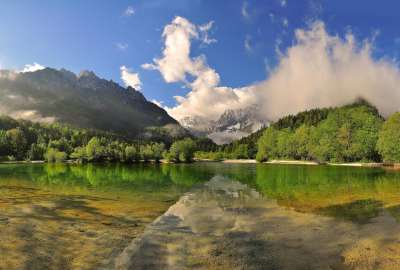 Mountain Reflection in Lake With Green Landscape