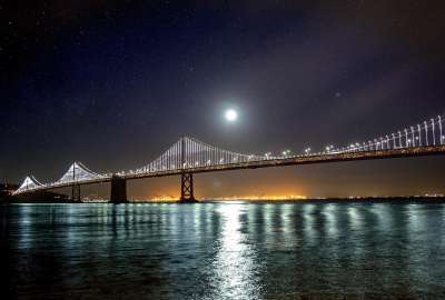 Night Bridge in the Lights Stars and Moon