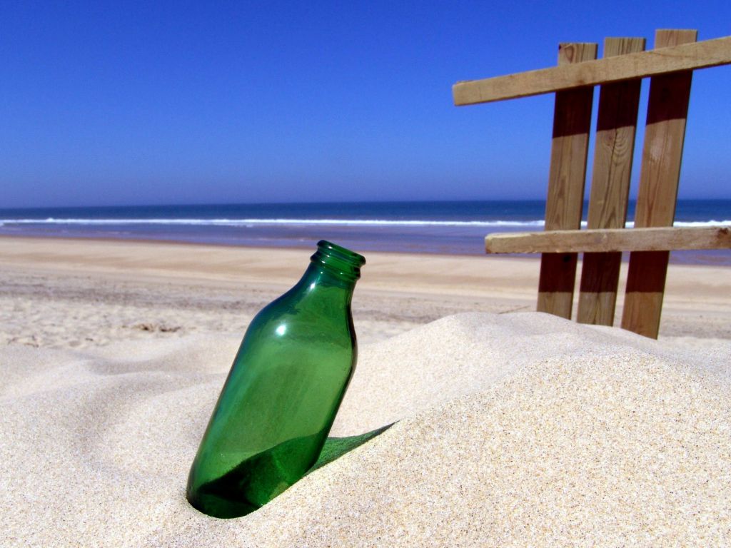 Bottle in Sand wallpaper