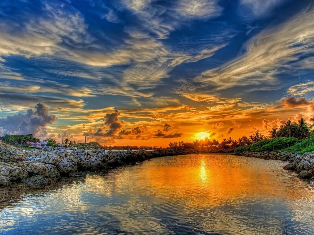 Breathtaking Golden Sunset Merging With The Lake wallpaper
