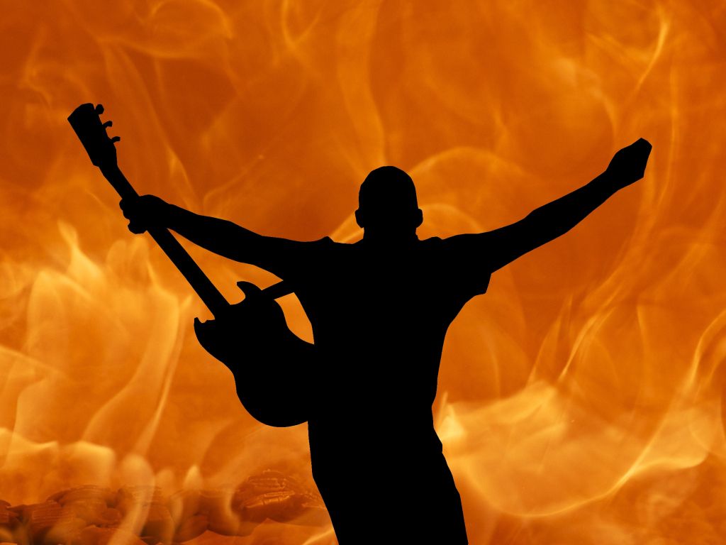Brings the Fire on Stage With His Guitar wallpaper