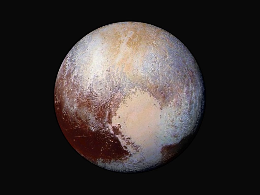 Enhanced Color Image of Pluto Used Detect Differences in the Composition and Texture wallpaper