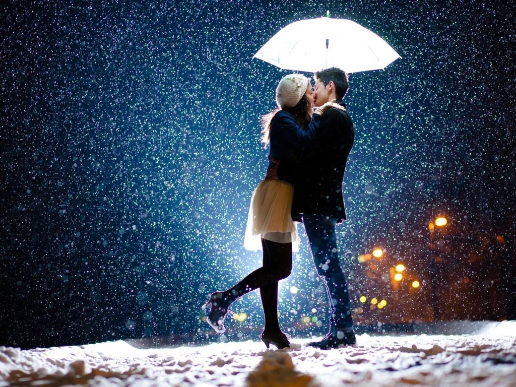 Girl and Boy Kissing in Snow wallpaper