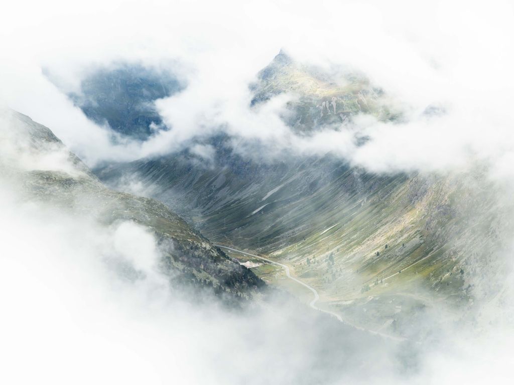 Grassy Mountains Masked by Clouds wallpaper