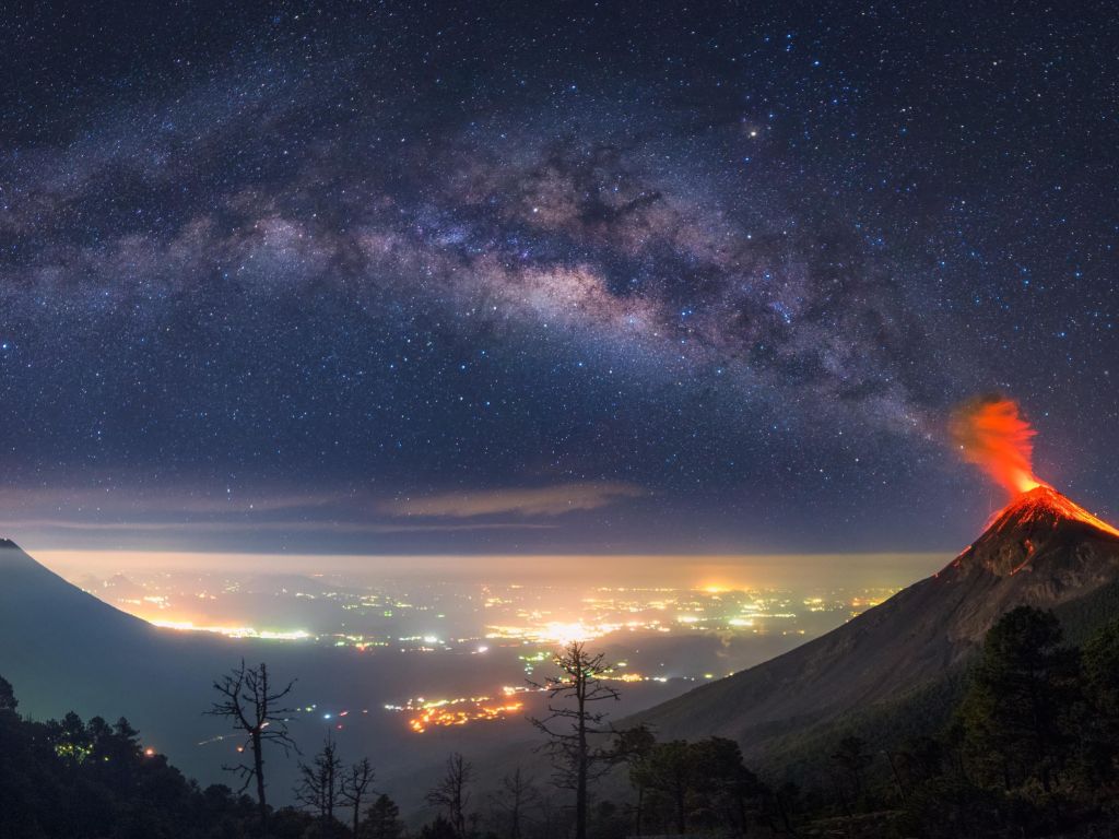 Milky Way Coming Out of an Erupting Volcano wallpaper