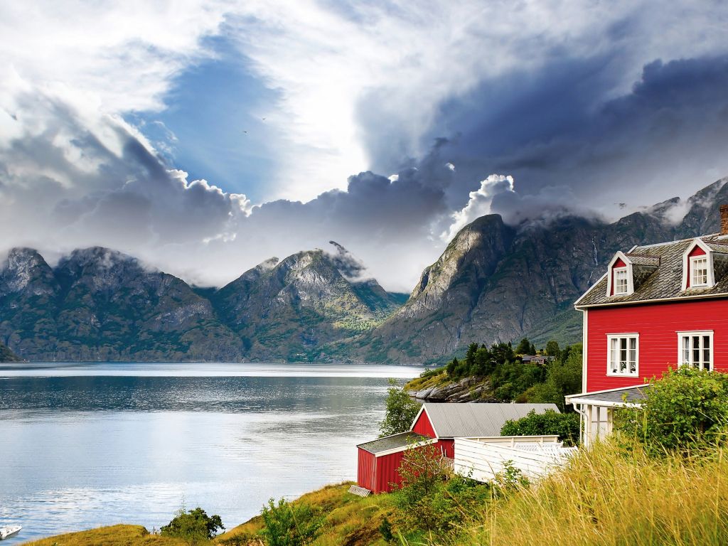 Red House Landscape Beside Water and Mountain wallpaper