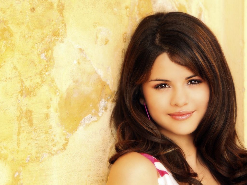 Selena Gomez Singers Selena Gomez Yellow Portrait 5997 wallpaper