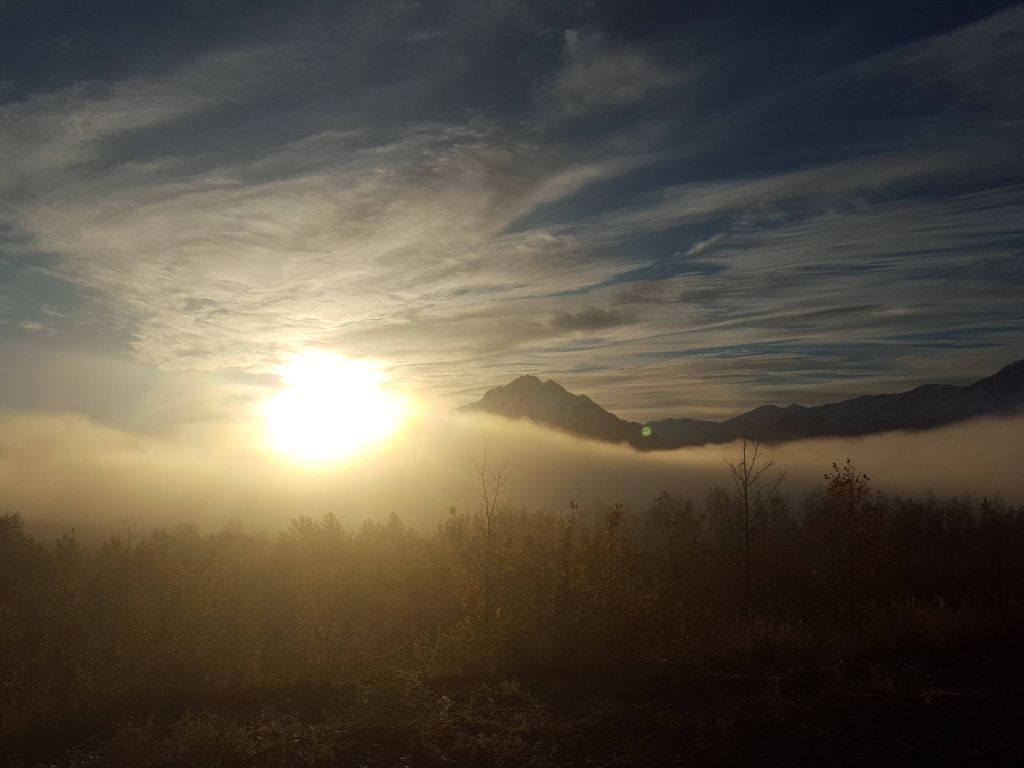 Sun Coming Through the Fog Ove the Matanuska Valley Alaska wallpaper