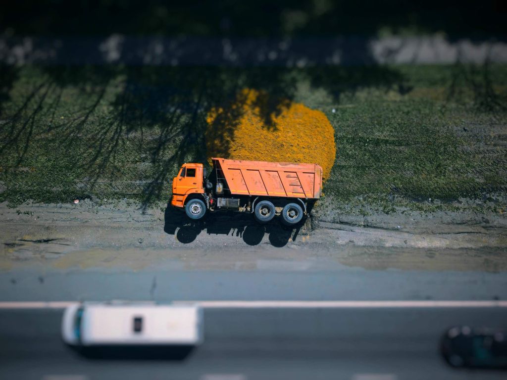 Tipped-Over Cargo Truck on Highway wallpaper